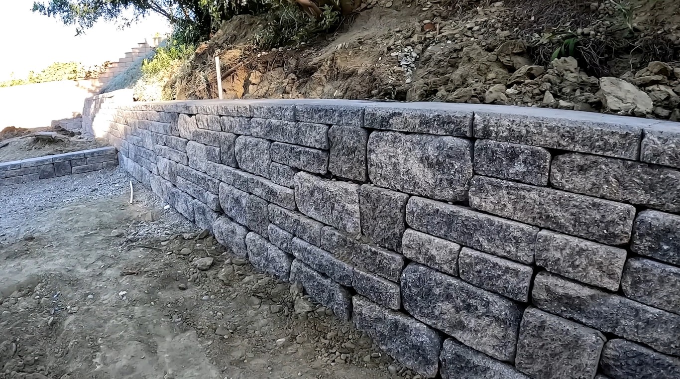 Stone retaining wall construction and installation by professional masons in Temecula, CA